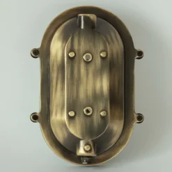 Ovale Messingwandleuchte mit Holophanglas
